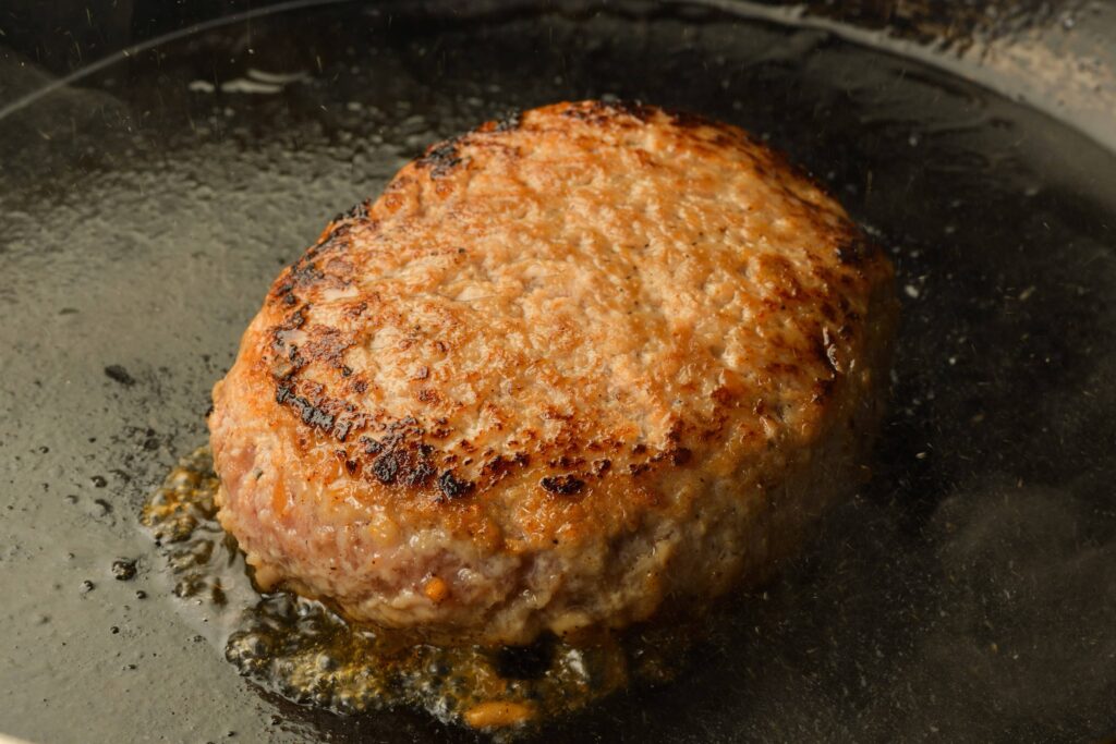 Halal A5 Wagyu Hamburg being cooked in a skillet